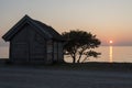 Cottage by the ocean in sunset Royalty Free Stock Photo