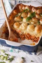 Cottage pie in the baking dish closeup. vertical