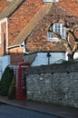 Cottage and red phone box in Winchelsea Royalty Free Stock Photo