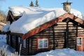 Cottage with snow on the roof