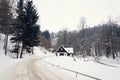 Cottage in snowy mountains country, foggy winter day, Czech republic