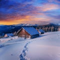 Cottage in snowy mountains with fabulous winter trees Royalty Free Stock Photo