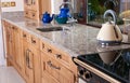 Cottage style kitchen in wooden finish and granite worktop Royalty Free Stock Photo