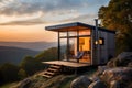 Cottage on top of a mountain with a beautiful landscape at sunset Royalty Free Stock Photo