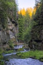 Cottage and waterfall by Kamenice river in Soutesky valley in National park Czech Switzerland near Hrensko village in spring Royalty Free Stock Photo