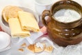 Cottage white cheese in a bowl , eggs and pastry