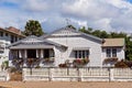 A Cottage With A White Picket Fence