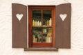 Cottage window shutters decorated with hearts. Ireland Royalty Free Stock Photo