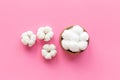 Cotton baby balls with cotton flowers, top view