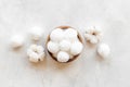 Cotton baby balls with cotton flowers, top view