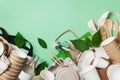 Cotton bag, glass jar, green leaves and recycled tableware top view. Zero waste, eco friendly, plastic free background. Flat lay Royalty Free Stock Photo