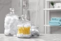 Cotton balls, swabs and pads on grey marble table in bathroom Royalty Free Stock Photo