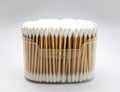 Cotton buds in box on white background.