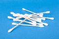 Cotton buds for cleaning auricles on blue background