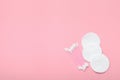 Cotton buds and cotton pads on a pink background. Hygiene supplies, beauty tools. Top view, copy space, flat lay Royalty Free Stock Photo