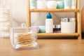 Cotton buds in a holder on the background of the bathroom. Royalty Free Stock Photo