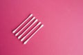 Cotton buds isolated on ping background