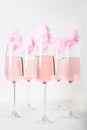 Cotton candy in a champagne glass. Pink champagne in a tall glass.A few glasses.