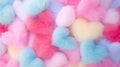 Cotton candy in the form of a colorful much of hearts, pastel background. Cute cotton candy in close-up, symbolizing romance and