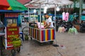 A cotton candy seller preparing as stock to sell to children in a city park