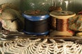 COTTON AND NYLON THREAD ON OLD WOODEN REELS Royalty Free Stock Photo