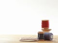 Cotton reels standing on a table with a white background Royalty Free Stock Photo