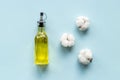 Cotton seeds oil with plant flowers. Essence extra virgin oil