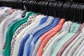 Cotton shirts hanging in row in a store Royalty Free Stock Photo