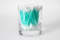 Cotton swabs in clear glass jar isolated on white Royalty Free Stock Photo