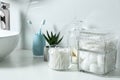 Cotton swabs, pads and balls on white countertop Royalty Free Stock Photo