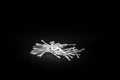 Cotton swabs up close scattered on a black background Royalty Free Stock Photo