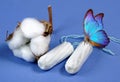 cotton tampon, intimate hygiene, gynecological menstruation cycle. Blue butterfly on a cotton tampon.