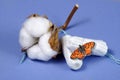 cotton tampon, intimate hygiene, gynecological menstruation cycle. Red butterfly on a cotton tampon.