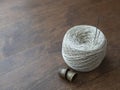 Cotton thread reel, needles and thimbles on the wooden surface Royalty Free Stock Photo