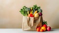 Cotton tote bag with fresh local produce bell pepper carrots celery broccoli tomatoes leafy greens. Organic bio produce Royalty Free Stock Photo