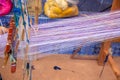 Cotton weaving on manual loom. Thai cotton handmade. Homespun fabric process. The process of fabric