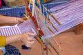 Cotton weaving. Woman hand weaving cotton on manual loom. Thai cotton handmade. Homespun fabric process. The process of fabric