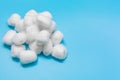 Cotton wool on blue background, Delicate soft cotton wool background, with copy space.
