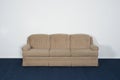 Couch or Davenport, Blue Carpet, Blank White Wall Royalty Free Stock Photo