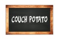 COUCH POTATO text written on wooden frame school blackboard