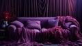 A couch with purple blankets on it