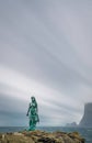 Kopakonan Seal Woman statue under the cloudscape