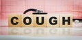 Cough word on wooden cubes. Conceptually for healthcare, hospital, clinic and medical business Royalty Free Stock Photo