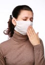 Coughing woman in a medical mask
