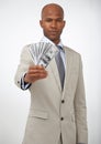 This could be yours. A handsome businessman showing you a wad of cash while isolated on a white background.