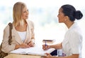 Could I have your contact details please. a young woman checking in at the reception desk.