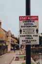 Council sign reminding residents and visitors of current social distancing guidelines during the Coronavirus pandemic, Bourton-on-