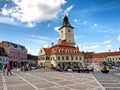 Local people and tourists relaxing in Brasov Council Square