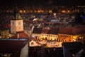 The Council Square of Brasov seen from above White Tower. Night view. Old City Hall Square.