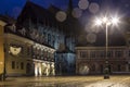 The Council Square during rain in Brasov, Romania. View with famous buildings in evening .